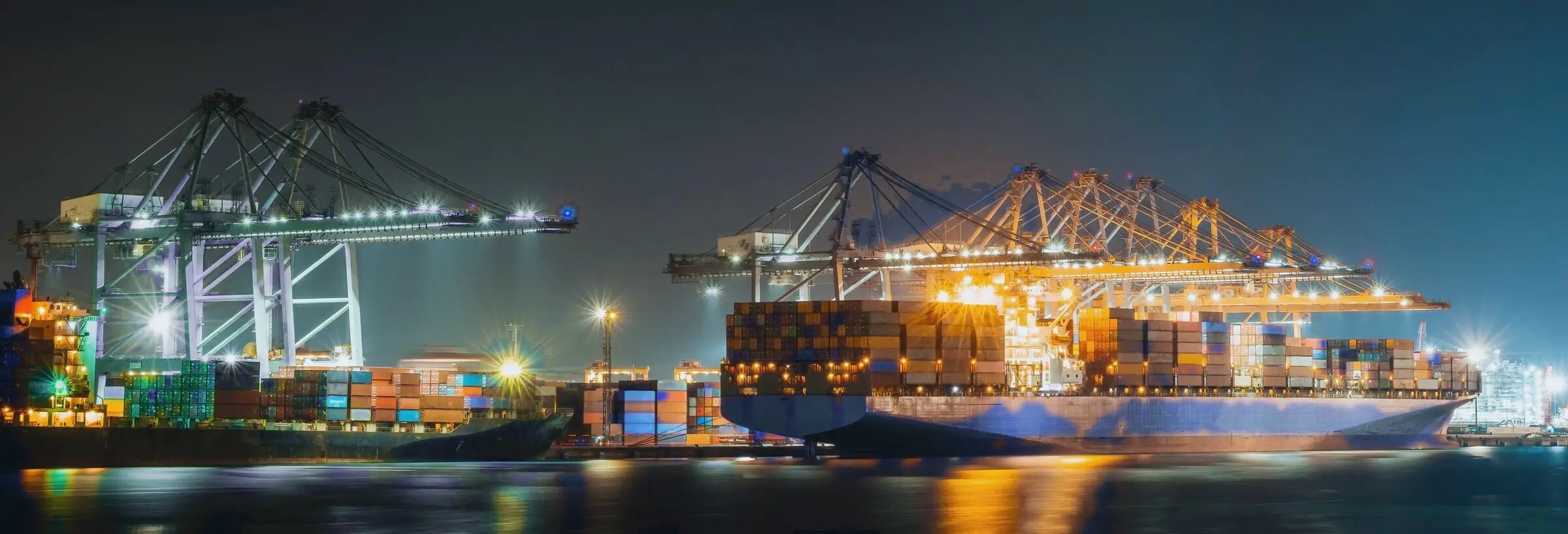 Container dock and cranes at night